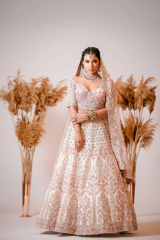 Ivory silk Lehenga with embroidered Corset Blouse